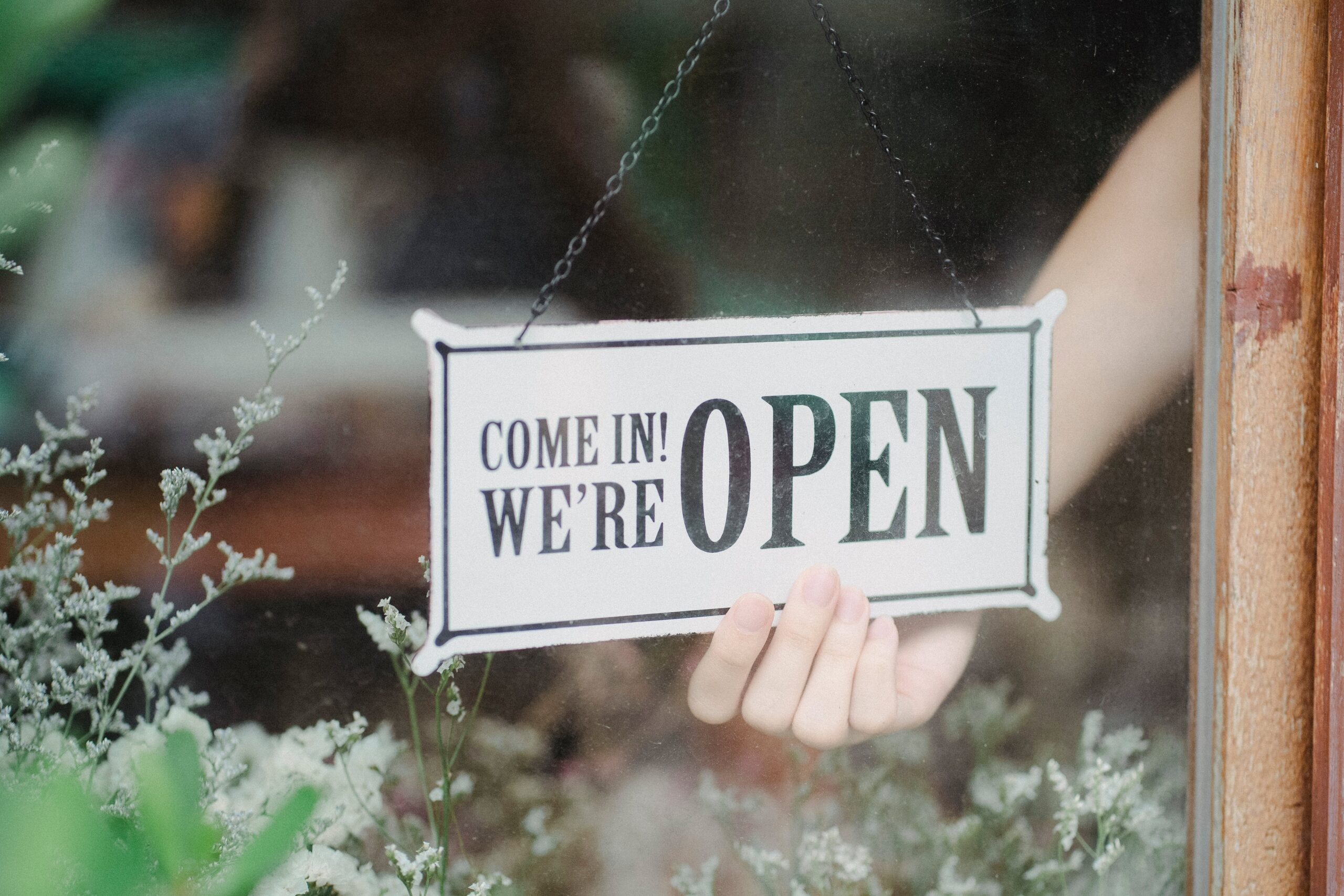 Come in we're open sign on storefront