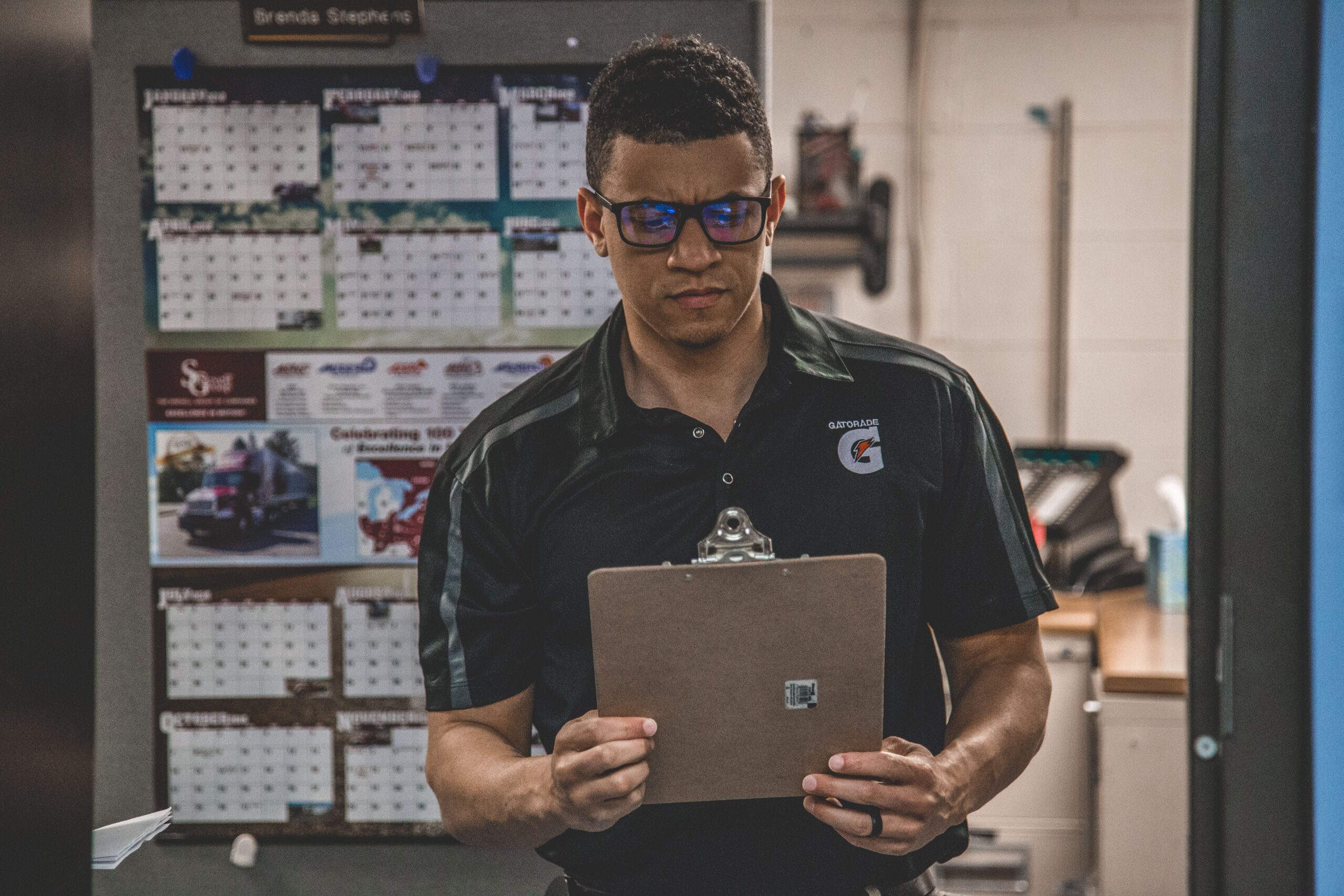 Employee looking at clipboard