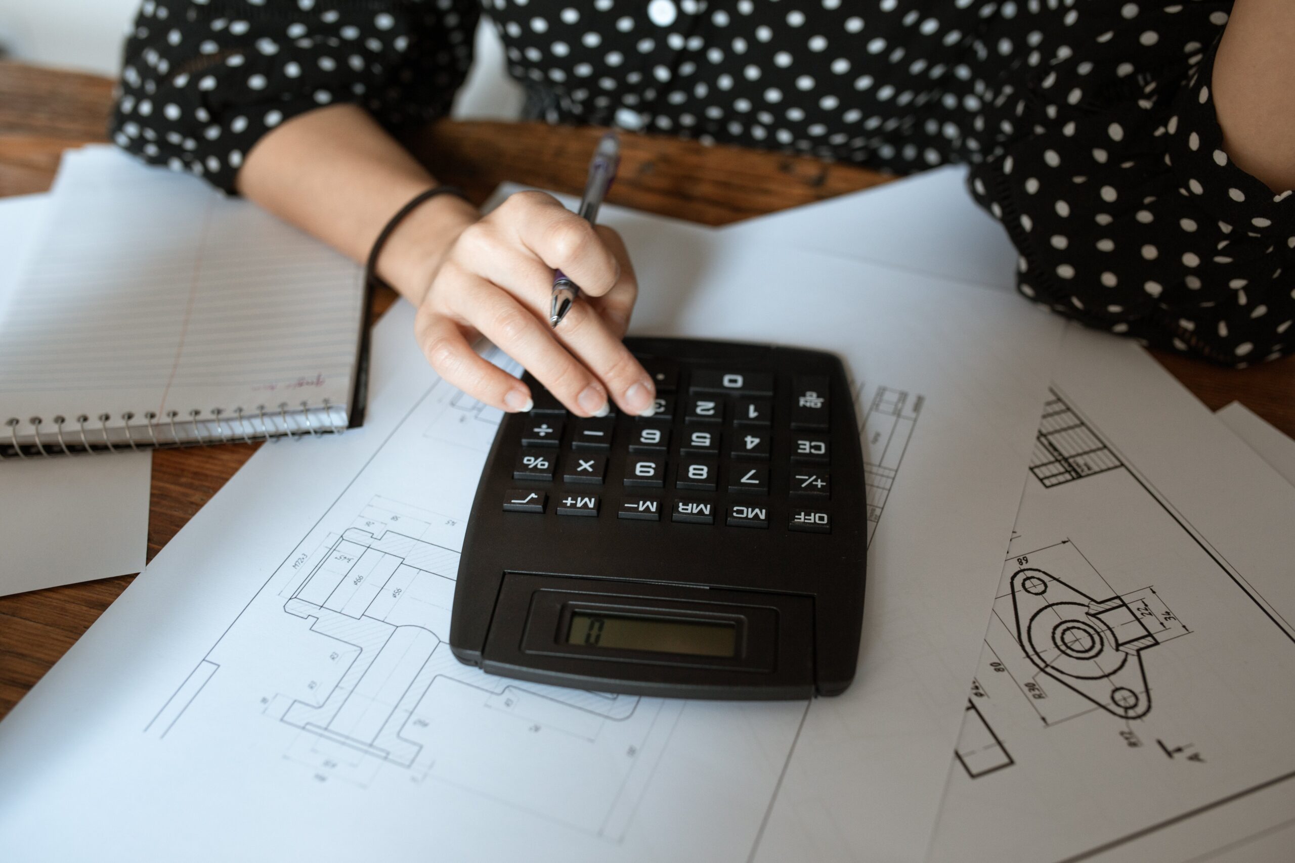 Woman using calculator