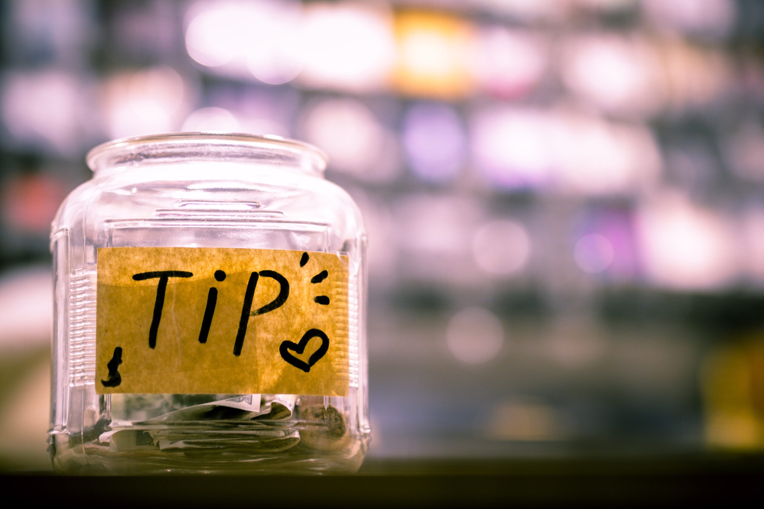 Tip jar with money in it